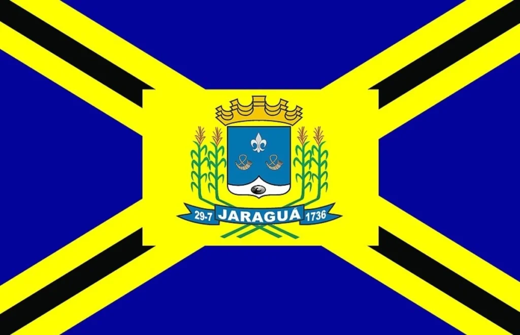 Bandeira oficial do município de Jaraguá, Goiás, com brasão central em fundo azul e amarelo